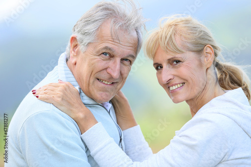 Senior people embracing each other with love