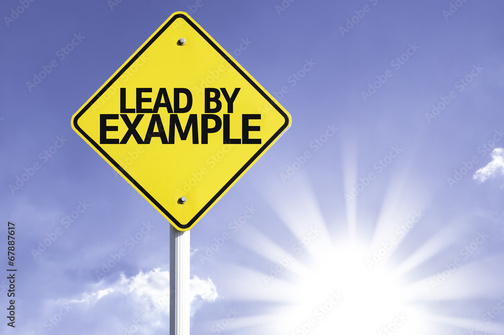 Lead by Example road sign with sun background Lead by Example road sign with sun background