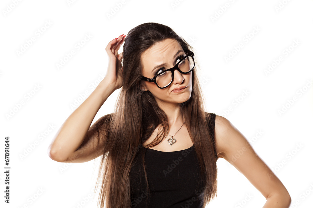 unsure young woman scratching her head - obrazy, fototapety, plakaty 