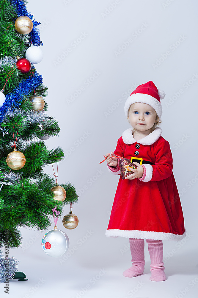 Christmas baby girl in a cap of Santa Claus