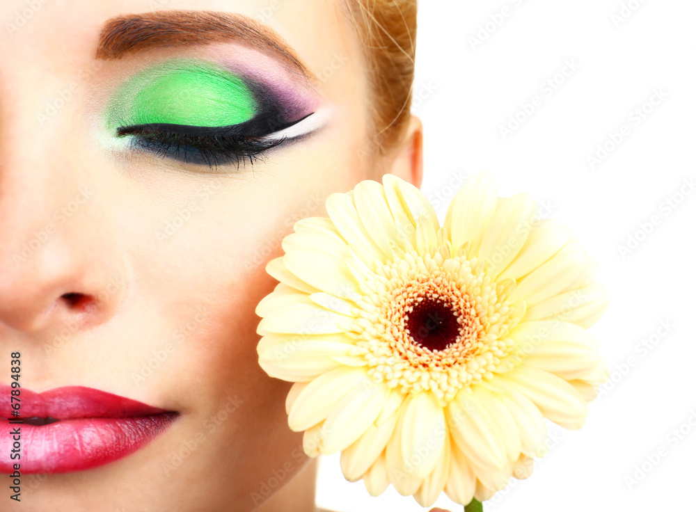 Beautiful woman with bright make-up and flower, close up Beautiful woman with bright make-up and flower, close up