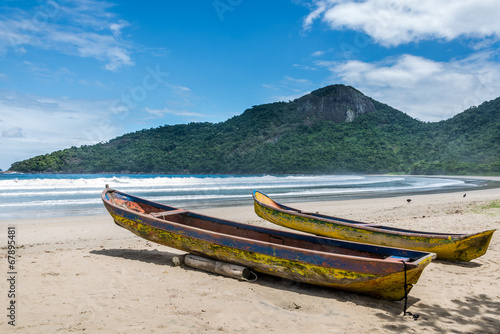 Two beautiful rustic fishing boats at Dos Rios beach, Ilha Grand