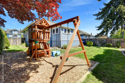 House backyard with playground for kids © Iriana Shiyan