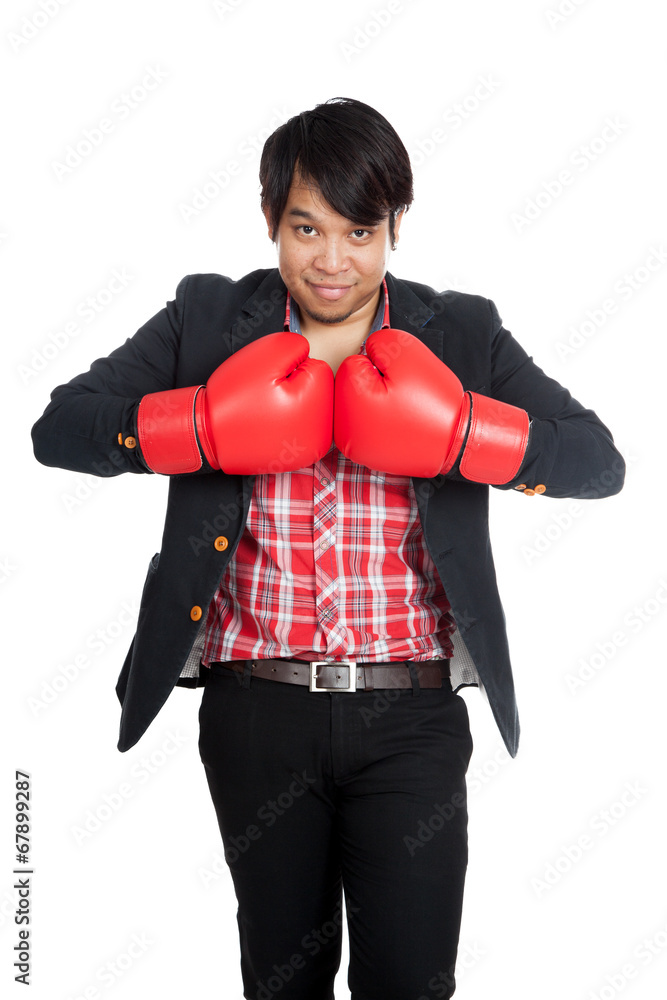 Asian businessman wear boxing gloves ready to fight Asian businessman wear boxing gloves ready to fight