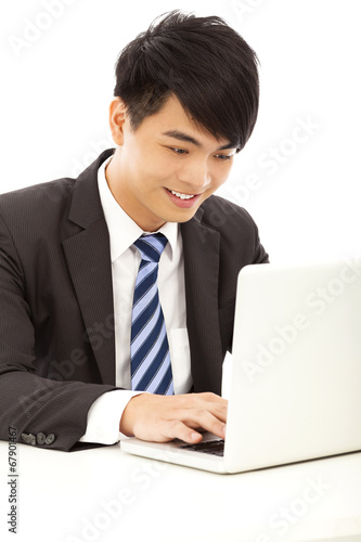 happy young business man using a laptop © Tom Wang