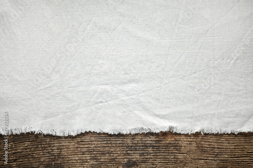 old white cotton tablecloth on wooden table photo