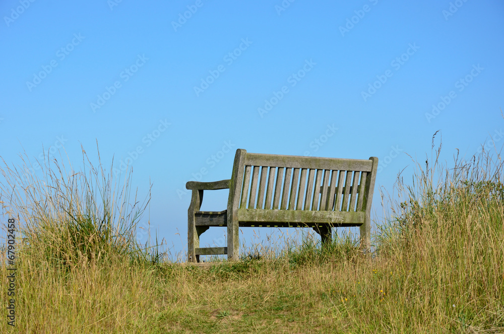 Empty wooden bench in countryside Empty wooden bench in countryside