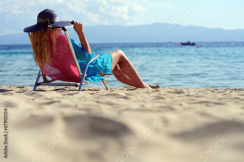 Woman lying deck chair