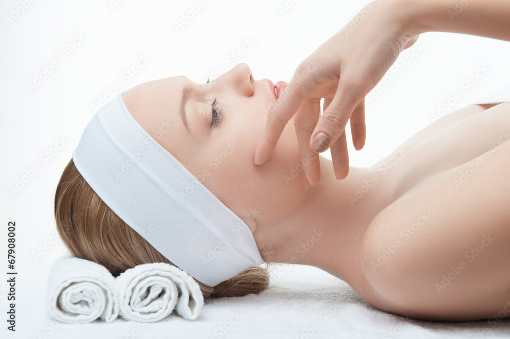 Young beautiful woman in spa relaxing on massage table Young beautiful woman in spa relaxing on massage table