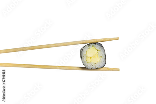 Avocado sushi roll in chopsticks isolated on white background