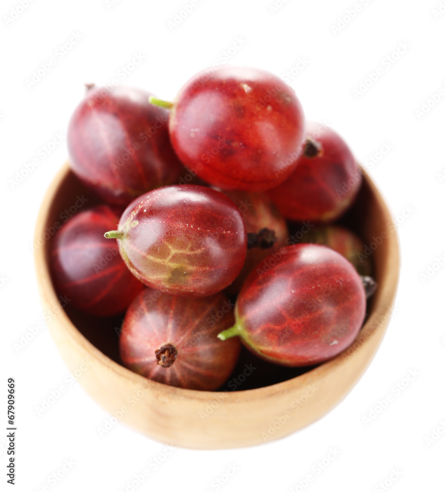 Ripe gooseberries in bowl isolated on white. Ripe gooseberries in bowl isolated on white.