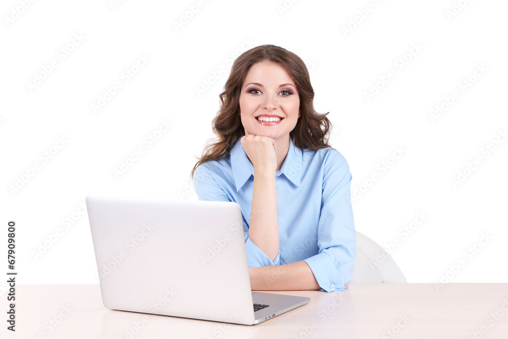 Young business woman sitting at table with notebook in room Young business woman sitting at table with notebook in room