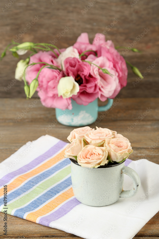 Bouquet of eustoma flowers and creamy roses on wooden Bouquet of eustoma flowers and creamy roses on wooden