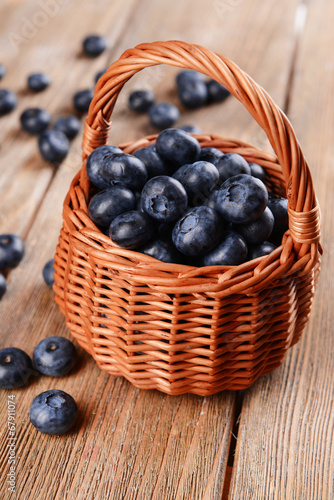 Wallpaper Mural Delicious blueberries in wicker basket on table close-up Torontodigital.ca