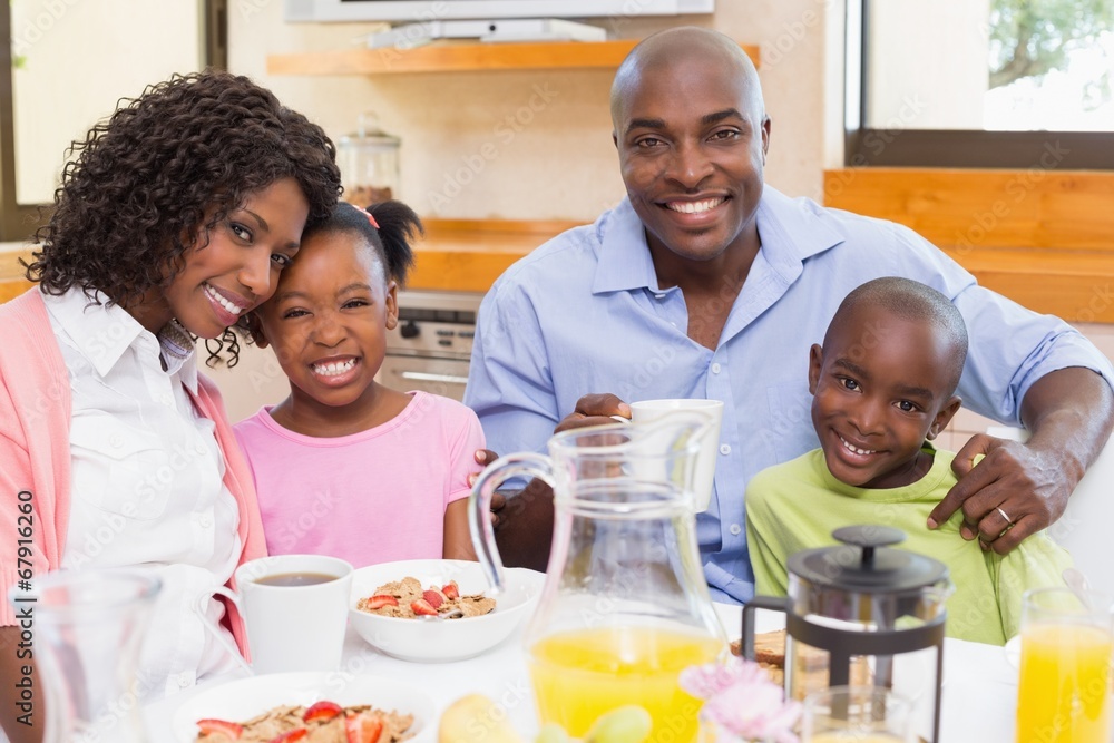 Happy family having breakfast together in the morning Happy family having breakfast together in the morning