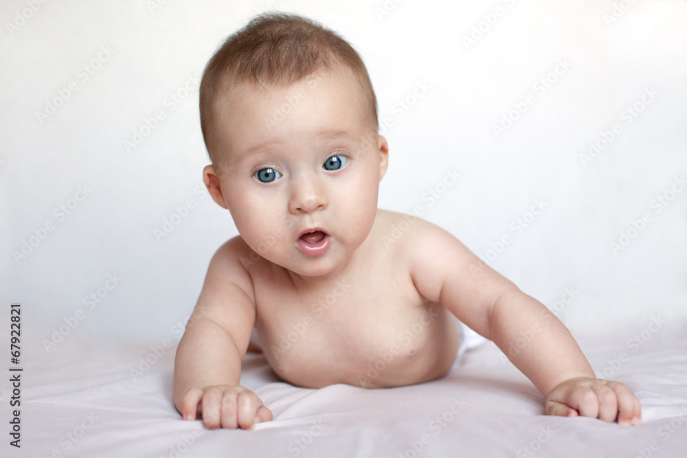 funny baby looking at camera in white background funny baby looking at camera in white background