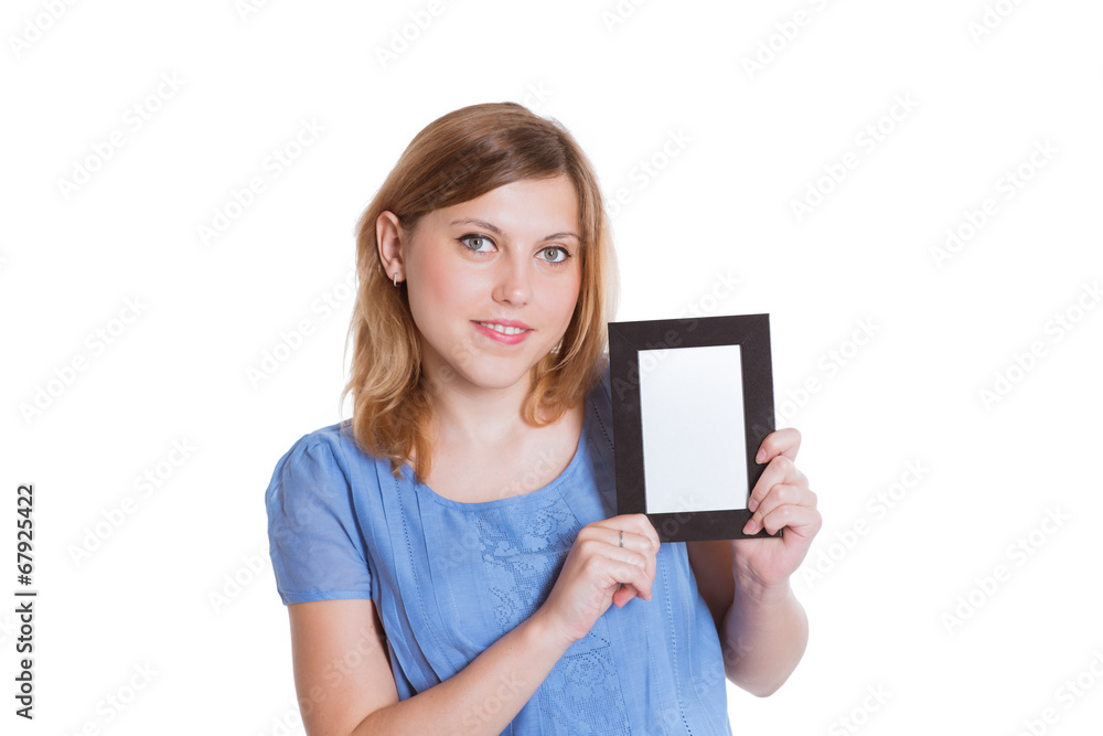 Portrait of a cheerful young brunette woman holding a white blan Portrait of a cheerful young brunette woman holding a white blan