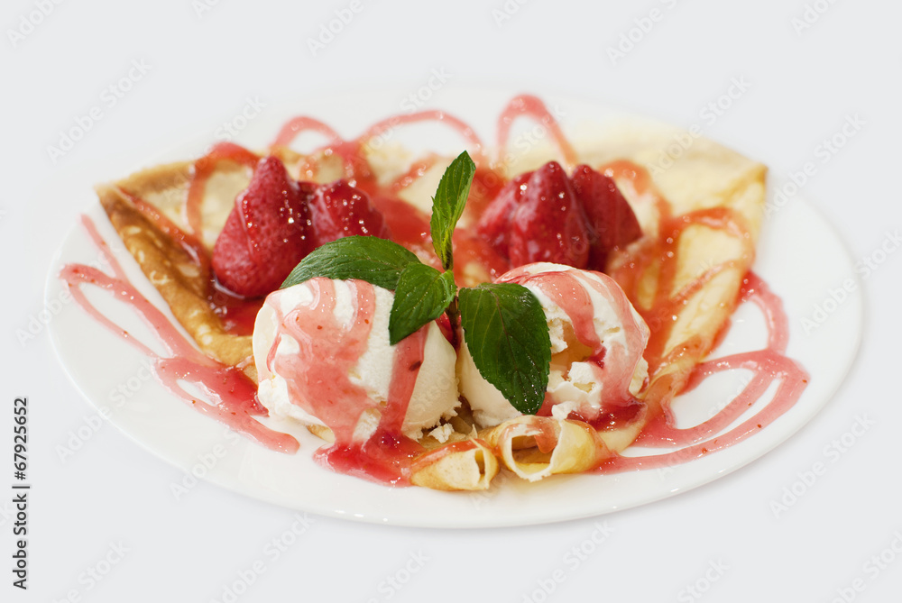 Ice cream with strawberry jam decorated with mint leaf closeup s Ice cream with strawberry jam decorated with mint leaf closeup s