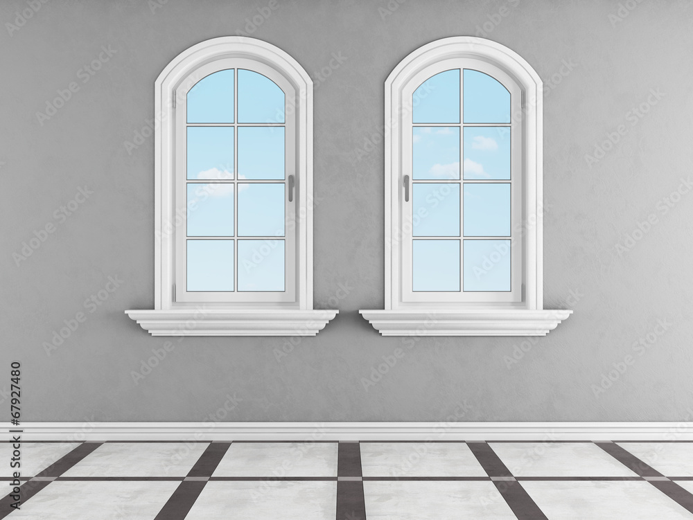 Gray room with two arched windows