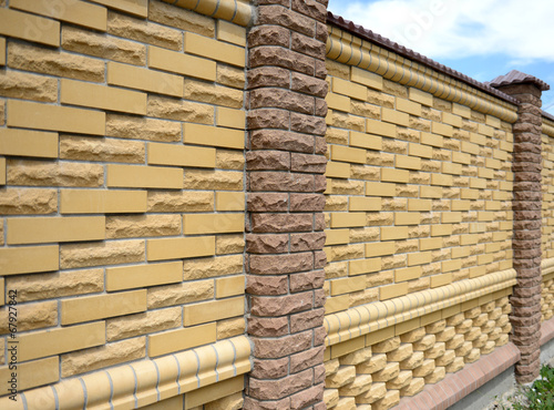 Fence of yellow bricks