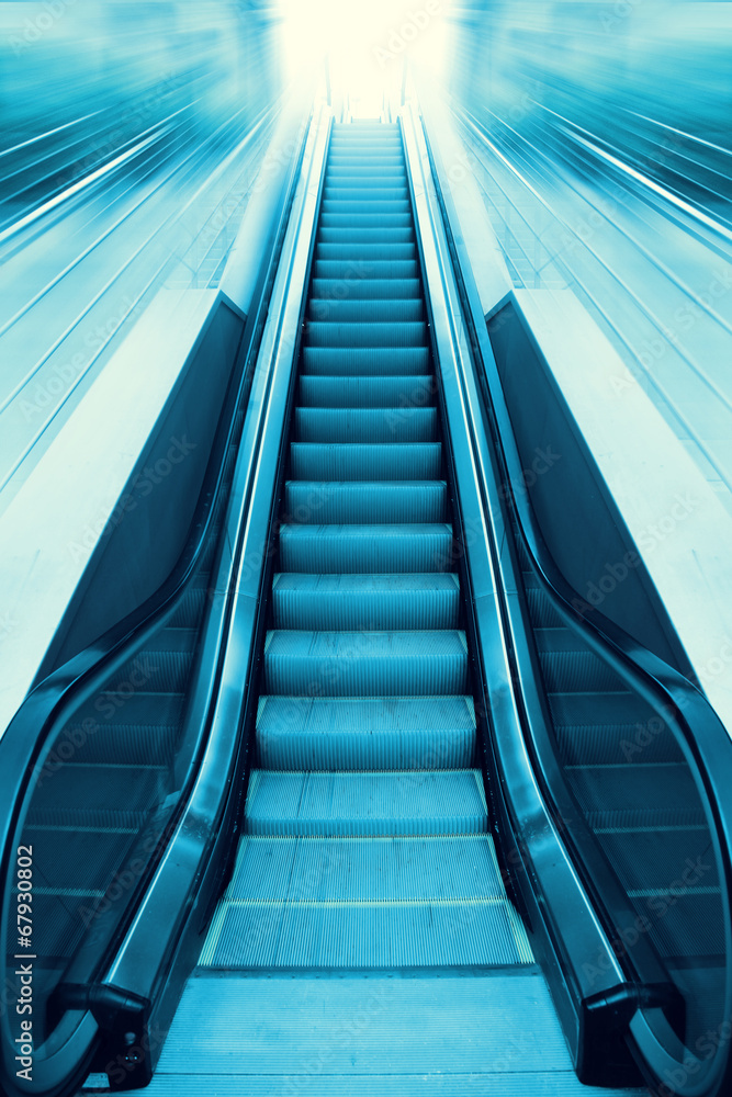 Escalator and light on background. Stock Photo | Adobe Stock