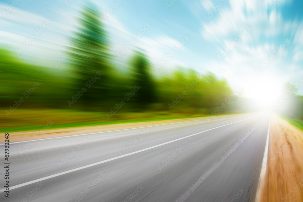 Asphalt road in motion blur on summer day. Asphalt road in motion blur on summer day.