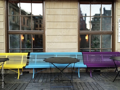 Photography colourful benches outside cafe in stockholm