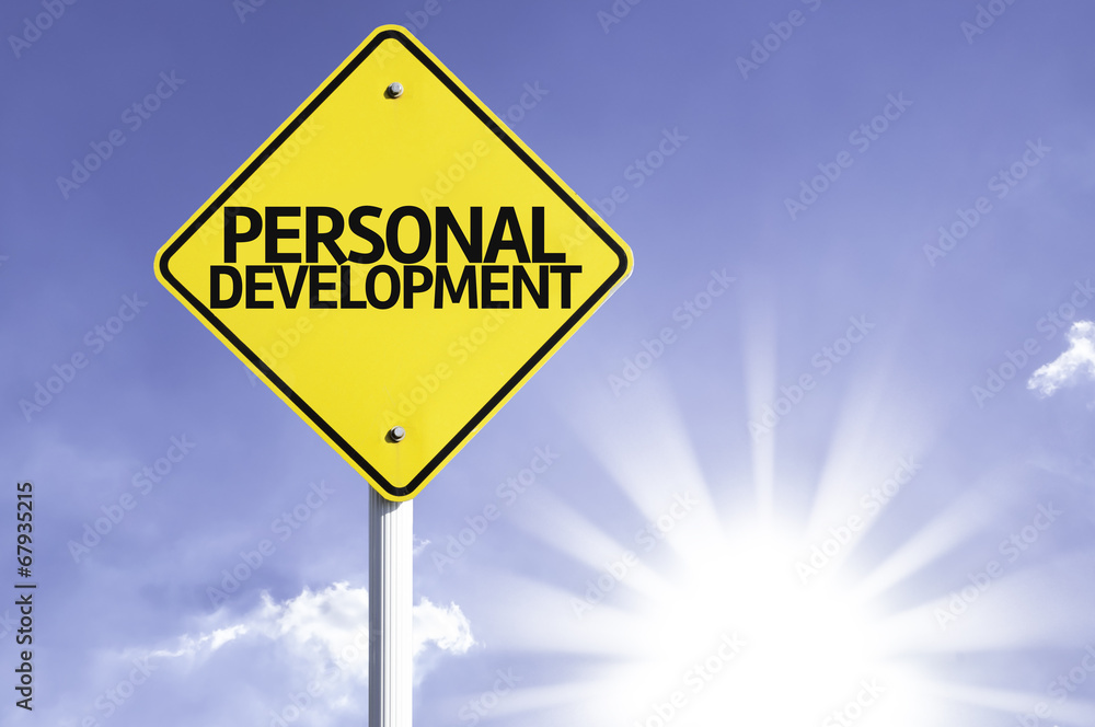 Personal Development road sign with sun background Personal Development road sign with sun background
