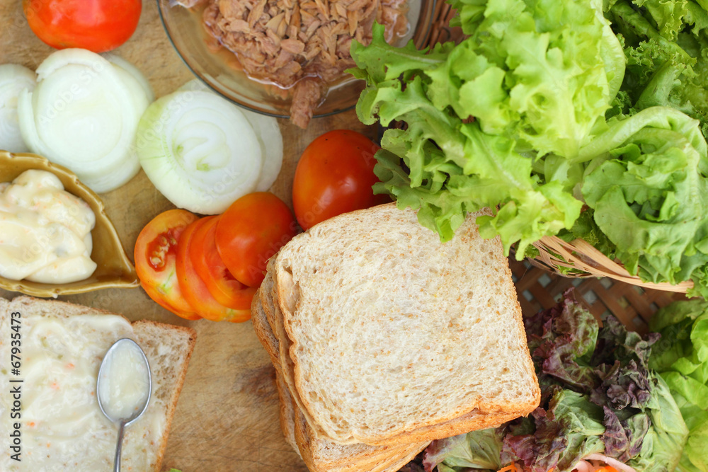 making tuna sandwich with fresh vegetables making tuna sandwich with fresh vegetables
