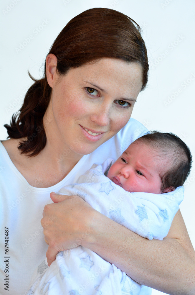 Mother and newborn baby kissing and hugging. Mother and newborn baby kissing and hugging.