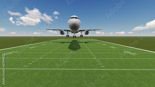 plane landing on ragby field photo