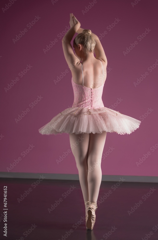Graceful ballerina standing en pointe Graceful ballerina standing en pointe
