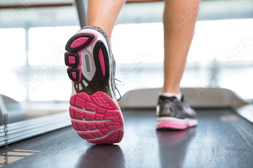Womans feet running on the treadmill © WavebreakMediaMicro