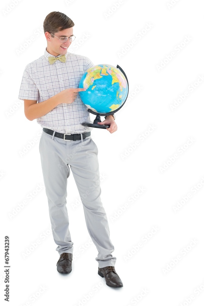 Geeky hipster holding a globe smiling at camera Geeky hipster holding a globe smiling at camera