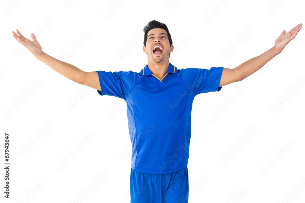 Happy football player in blue celebrating Happy football player in blue celebrating