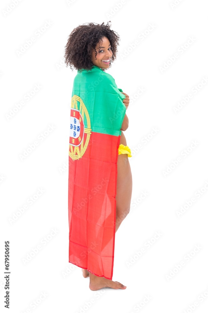 Smiling girl in bikini holding portugal flag
