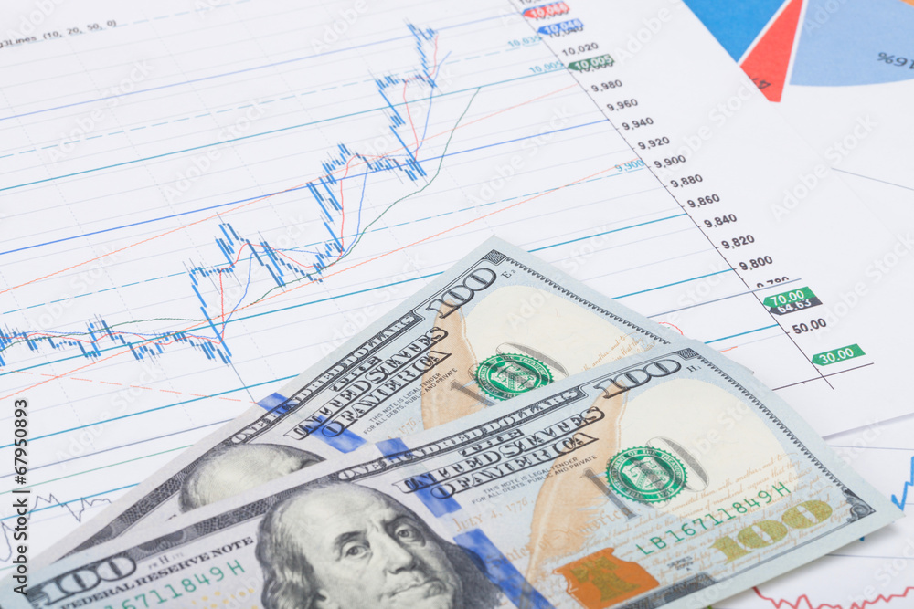 Stock market chart with 100 USA dollars banknote - studio shot Stock market chart with 100 USA dollars banknote - studio shot