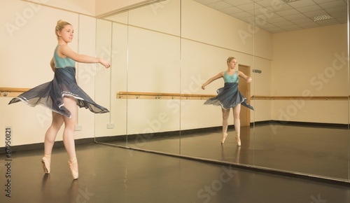 Beautiful ballerina dancing in front of mirror © WavebreakmediaMicro