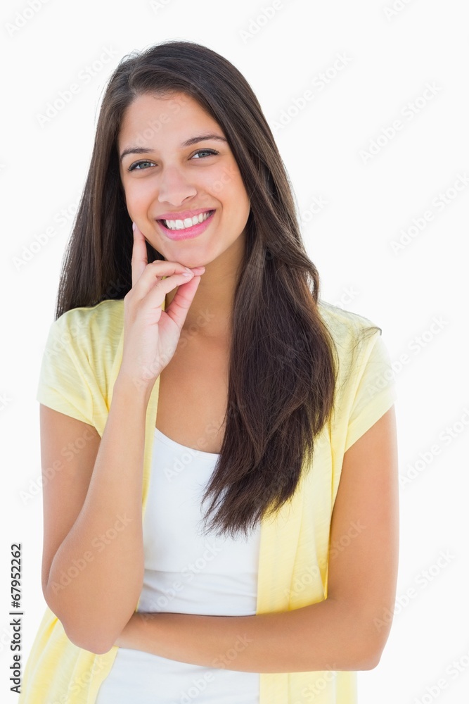 Happy casual woman thinking with hand on chin Happy casual woman thinking with hand on chin