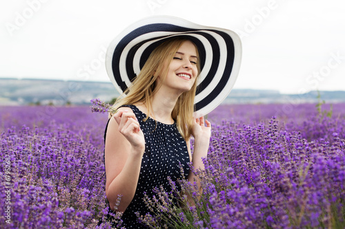 Adorable girl in fairy field of lavender