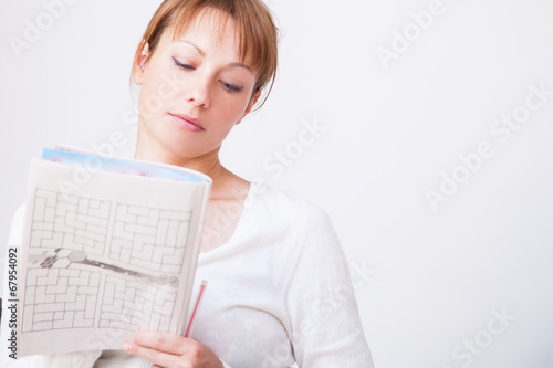 Woman doing crosswords