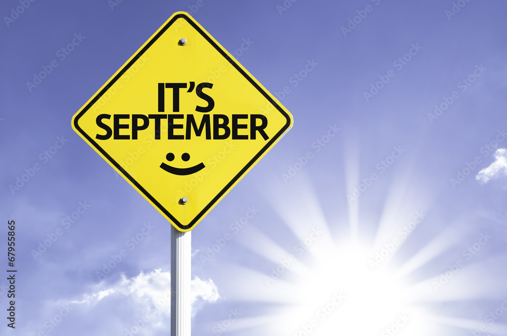 It's September road sign with sun background
