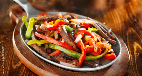 mexican beef fajitas with bell peppers panoramic shot photo