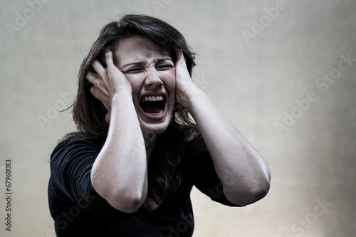 Fotografie Angry young woman shouting
