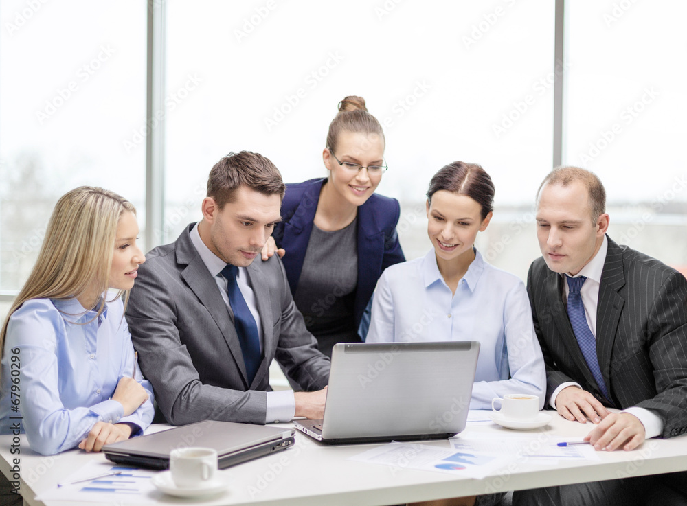 business team with laptop having discussion business team with laptop having discussion
