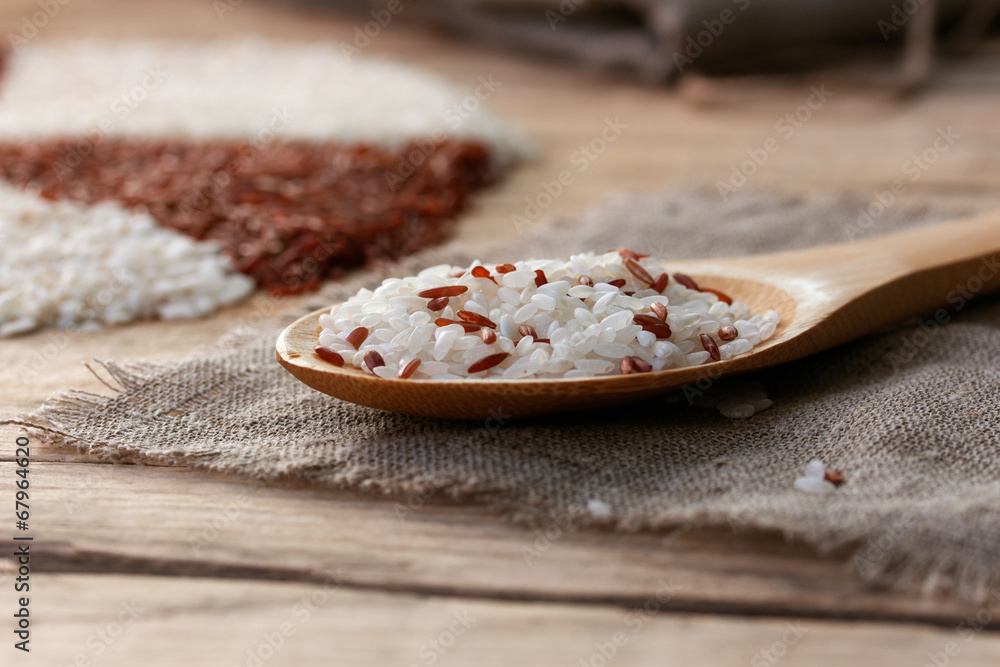 white and red rice in a wooden spoon white and red rice in a wooden spoon