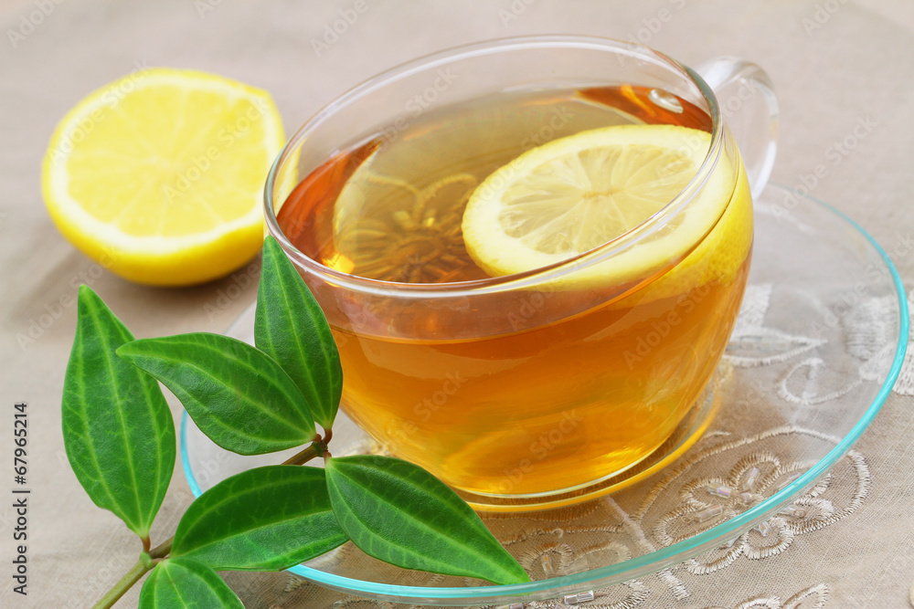 Lemon tea and green leaves Lemon tea and green leaves