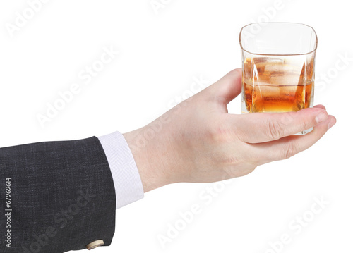 whiskey glass in businessman hand