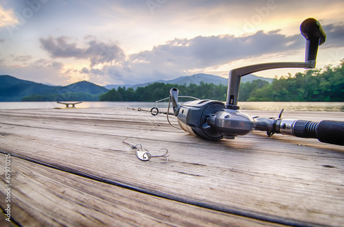 Принти на полотні fishing tackle on a wooden float with mountain background in nc