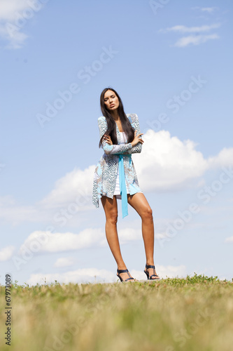 Beautiful young woman in blue sexy dress